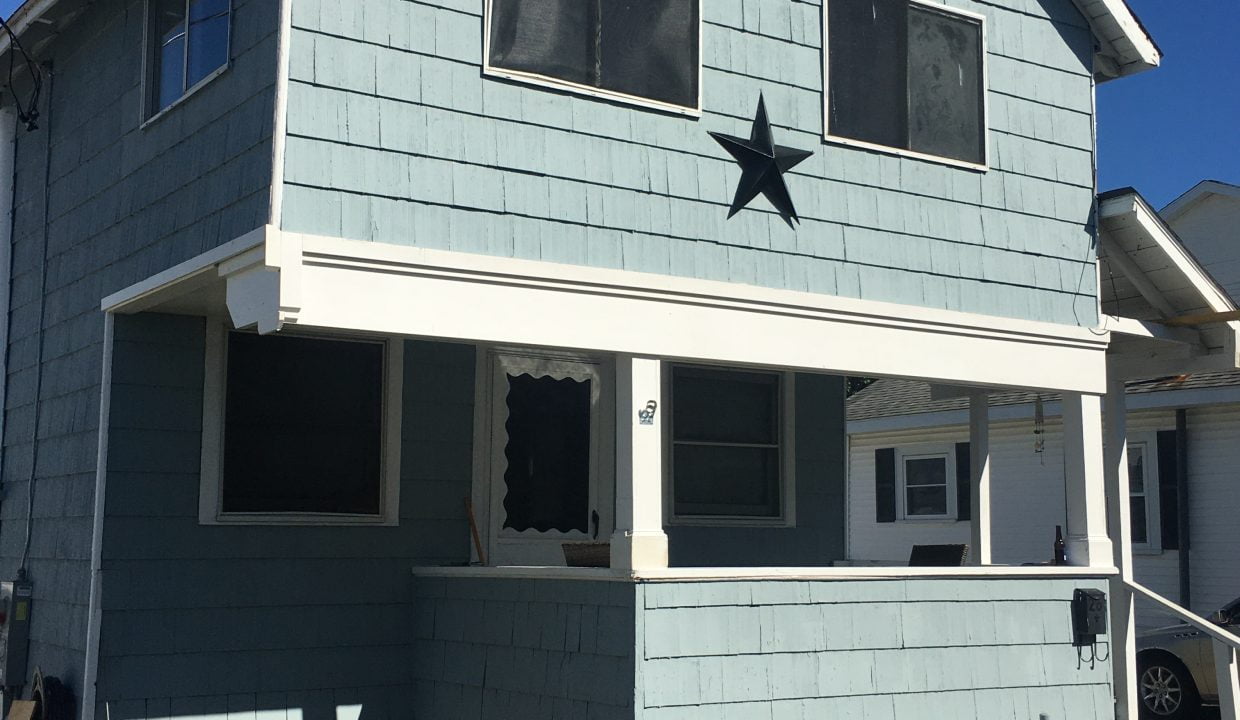 A blue house with a star on it.