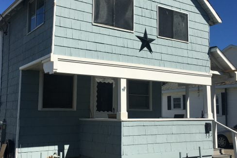 A blue house with a star on it.