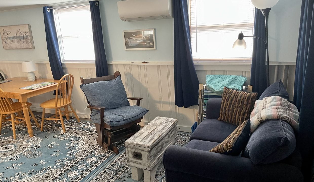 A living room with couches and chairs.