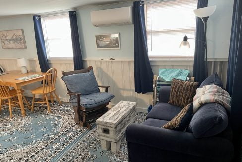 A living room with couches and chairs.