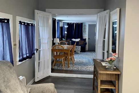 A living room with a couch and chairs.