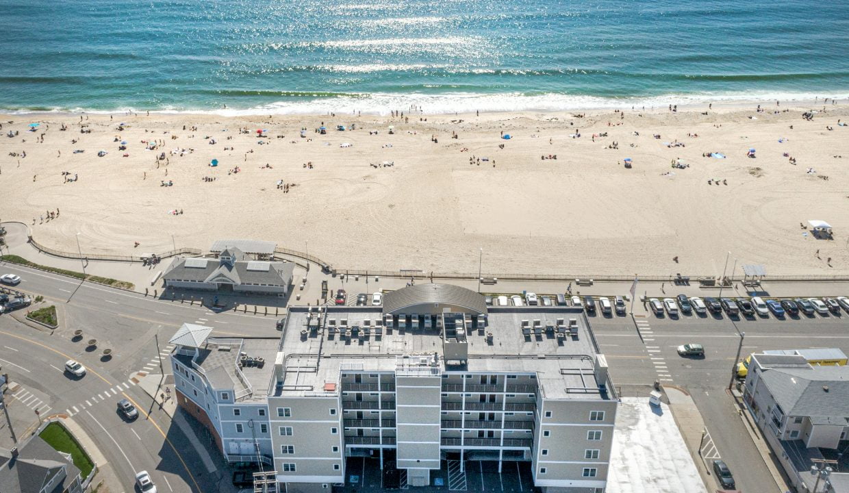 An aerial view of a beach and a building.