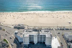 An aerial view of a beach and a building.