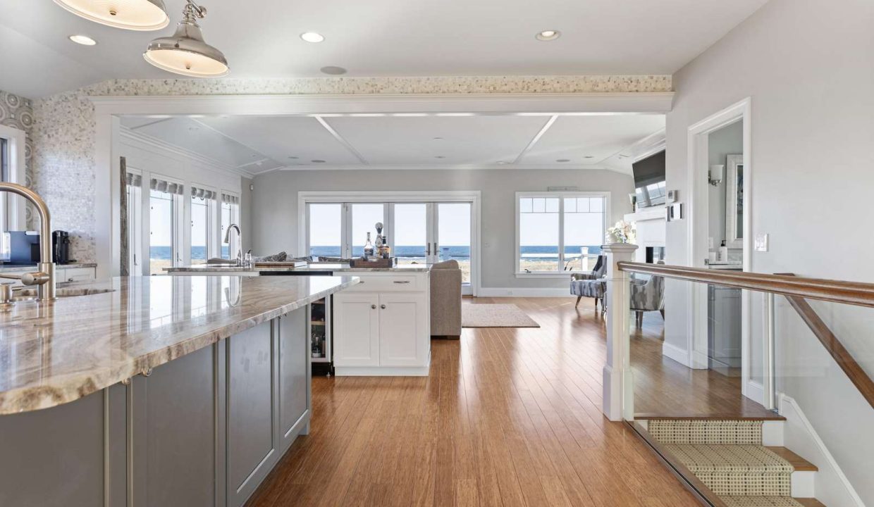 A spacious kitchen with modern appliances and an ocean view.