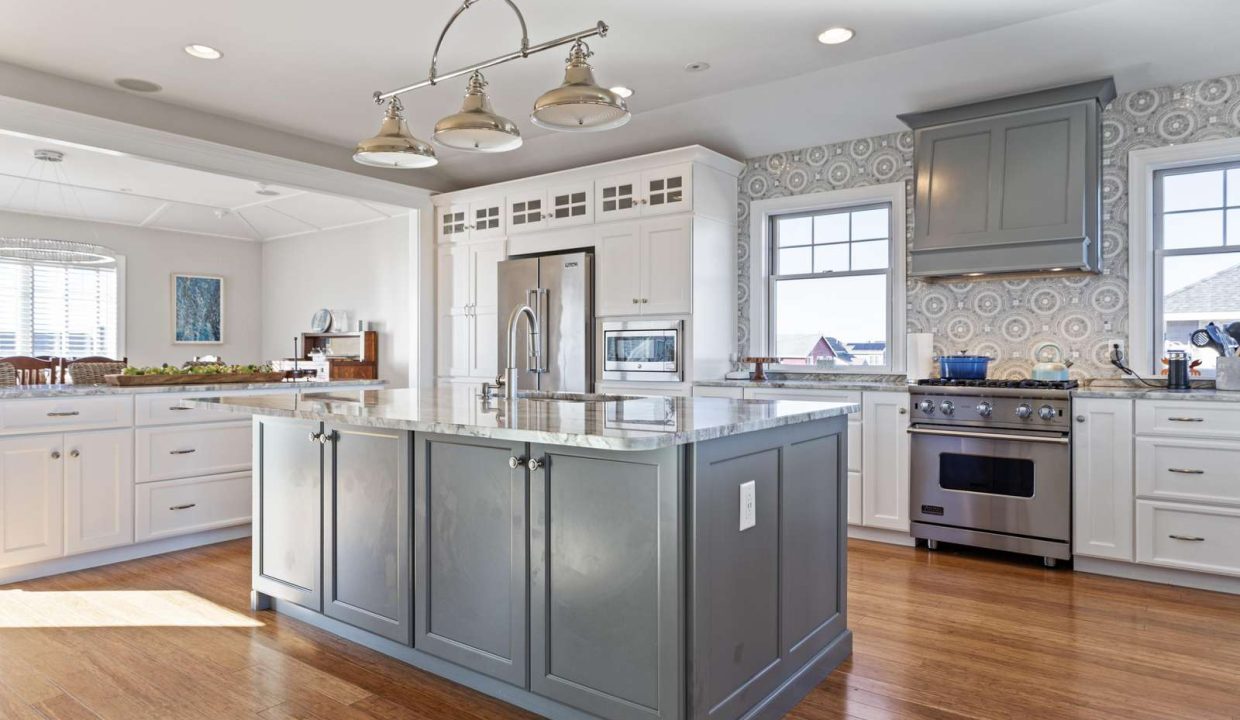 Spacious kitchen with modern appliances and a central island.