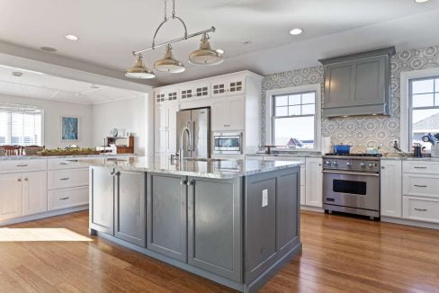 Spacious kitchen with modern appliances and a central island.