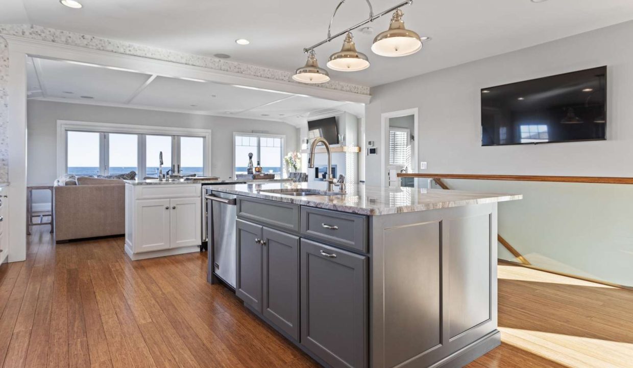 Bright contemporary kitchen with a center island and ocean view.