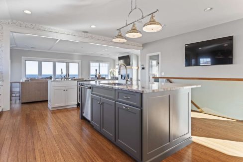 Bright contemporary kitchen with a center island and ocean view.